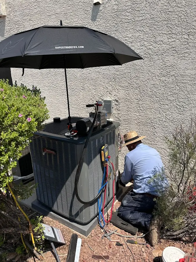 HVAC technician performing outdoor AC maintenance in Jersey City